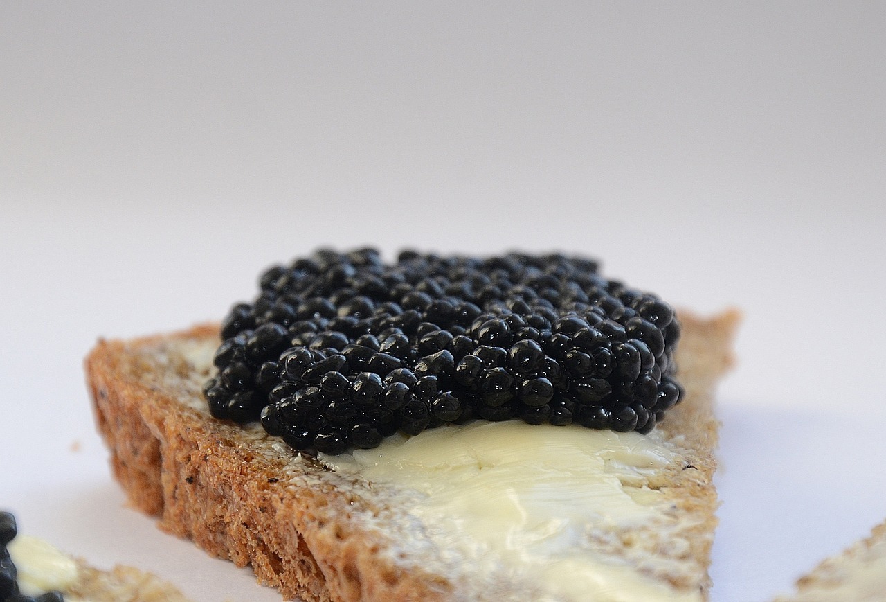 black caviar on a buttered toast point