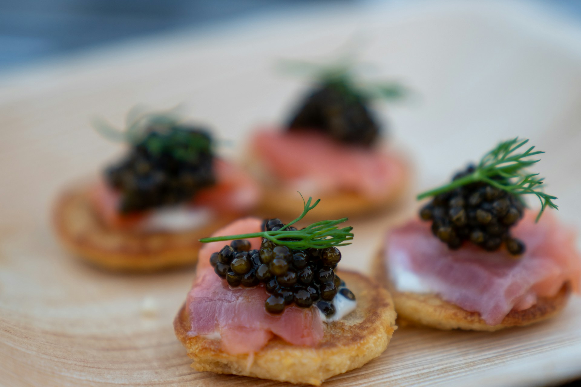 caviar and garnish on small pancakes