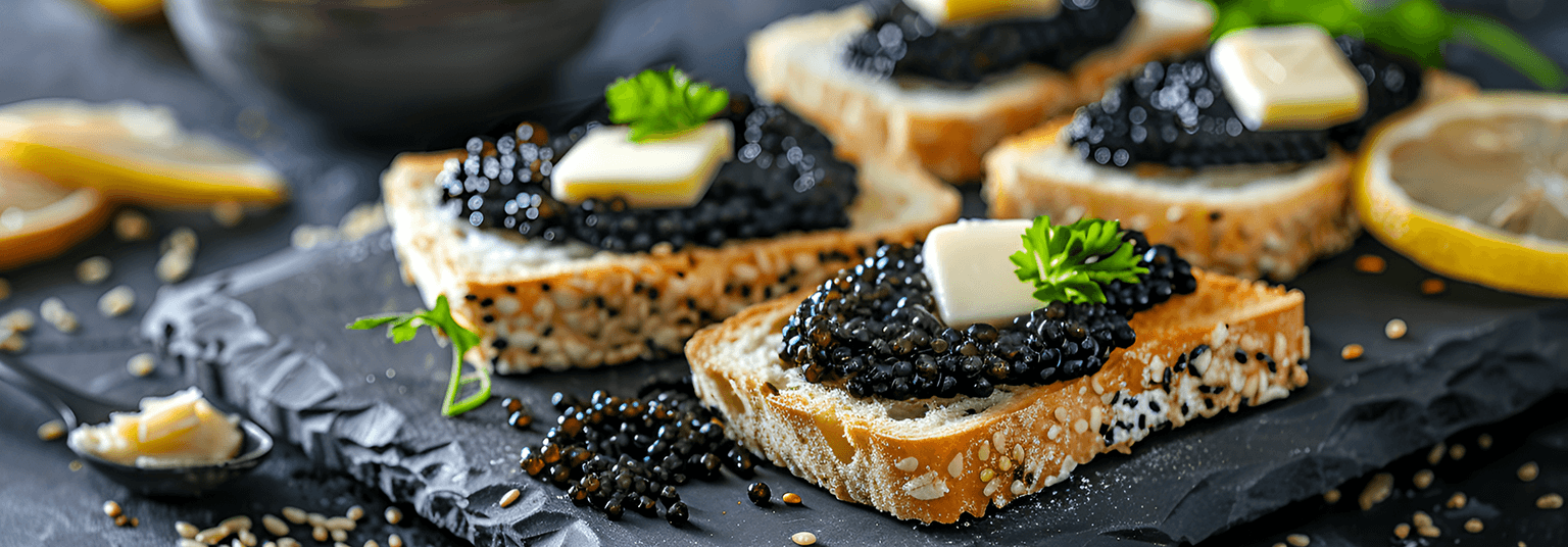 Sturgeon caviar served on miniature toasts