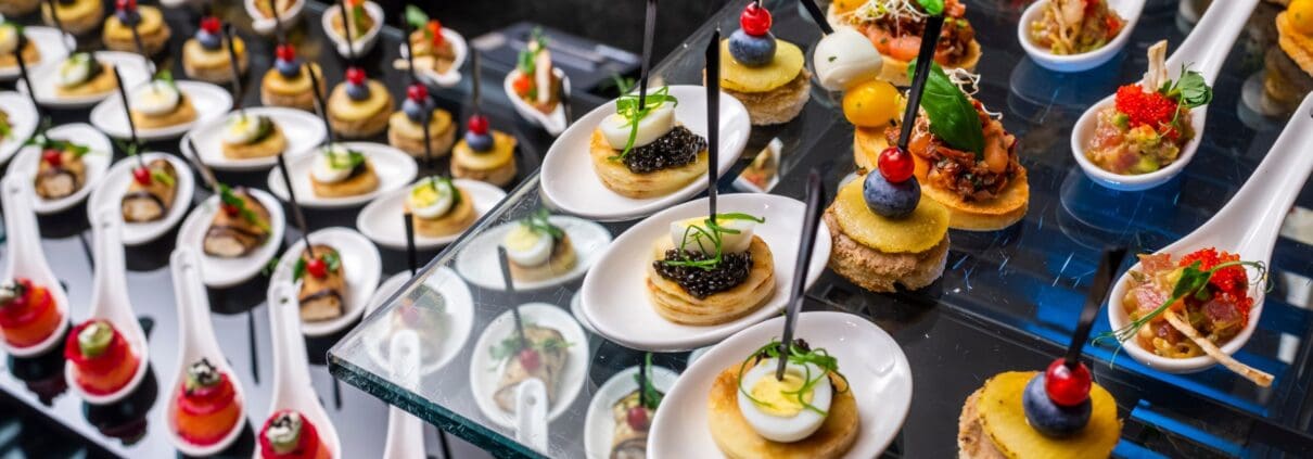 A buffet table with caviar appetizers