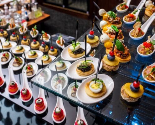 A buffet table with caviar appetizers