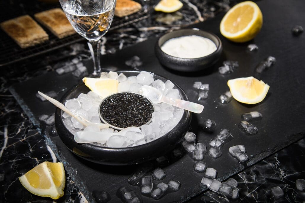 Caviar served on ice with mother-of-pearl spoons