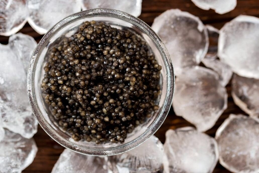 Caviar in a glass bowl on ice