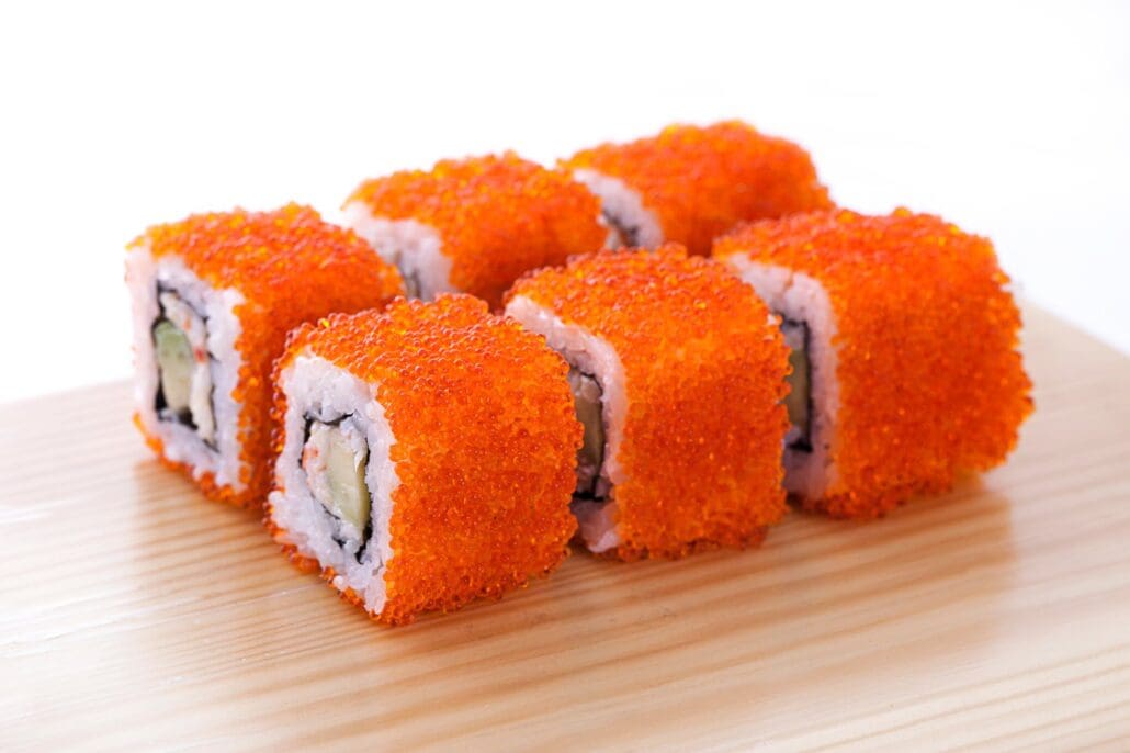 Sushi rolls covered in masago roes