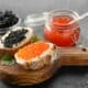 An assortment of caviar and roe served with bread